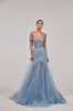 Long off-the-shoulder prom dress with inner skirt sold by Milla