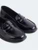 Sperry Black Patent sold by L'Intervalle