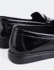 Sperry Black Patent sold by L'Intervalle
