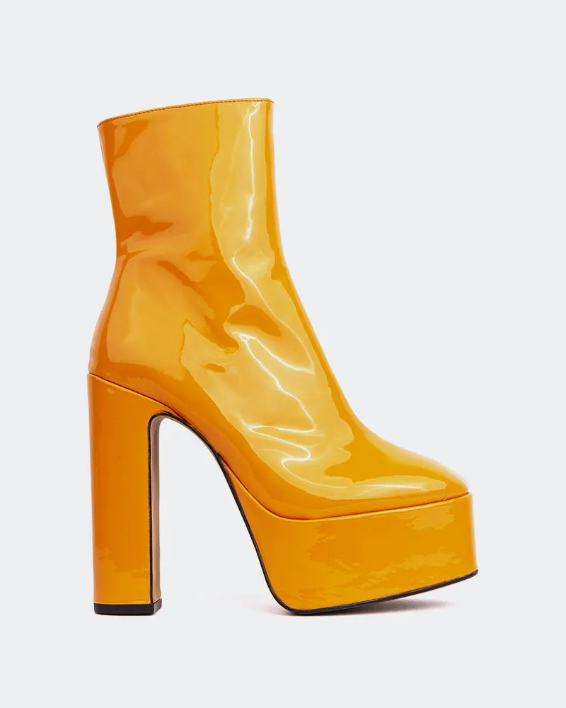 Doja Orange Patent sold by L'Intervalle