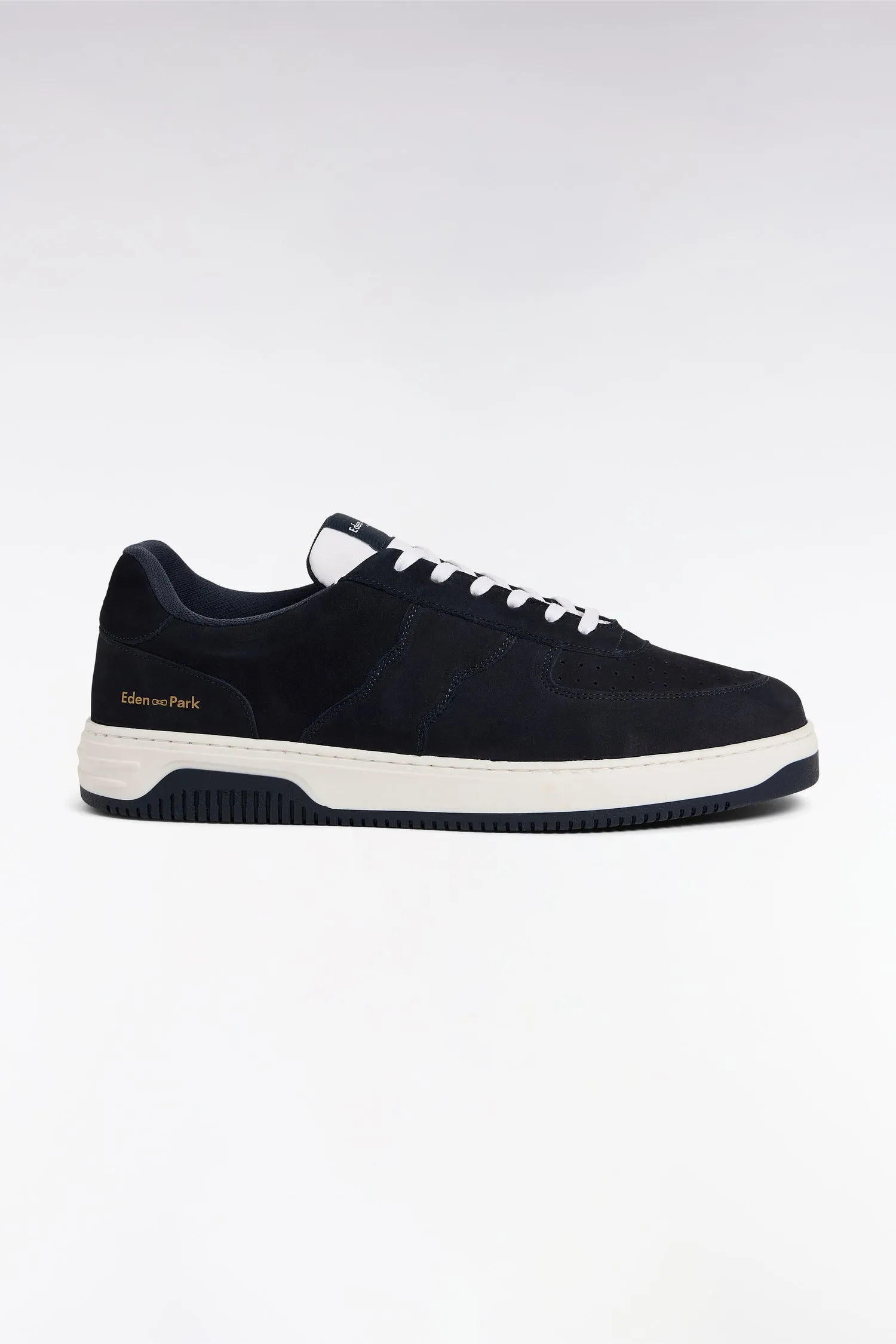 sneakers en cuir marine à semelles blanches sold by Eden Park