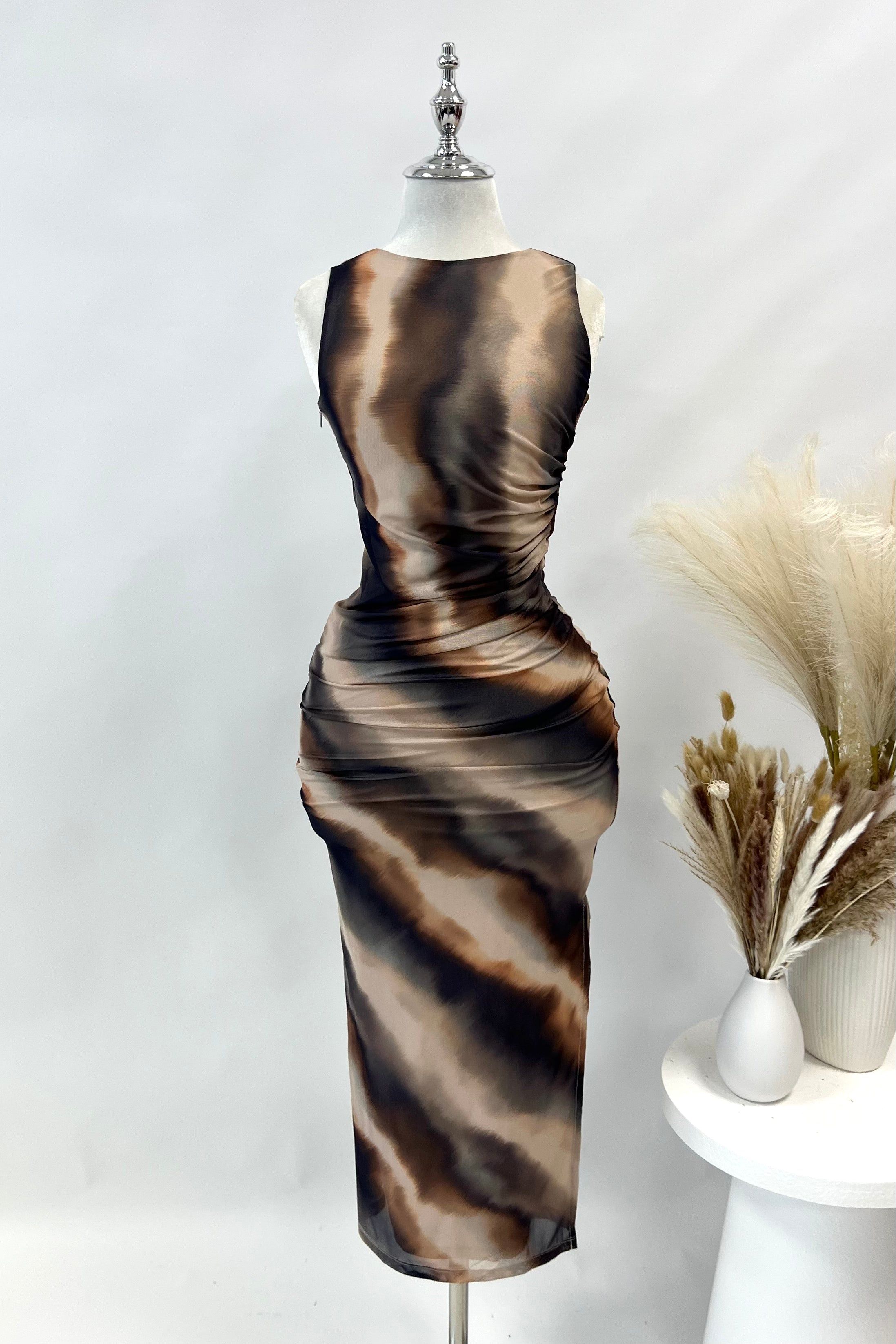 Devyn Midi Dress sold by Kameli Boutique