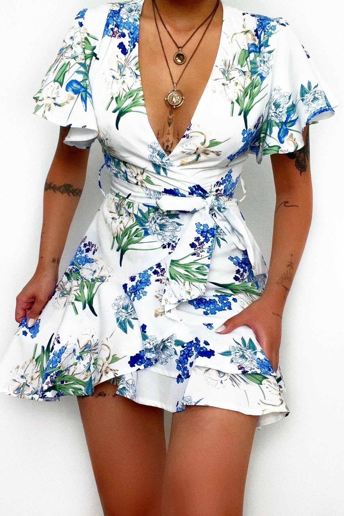Santorini Floral Mini Dress sold by Kameli Boutique