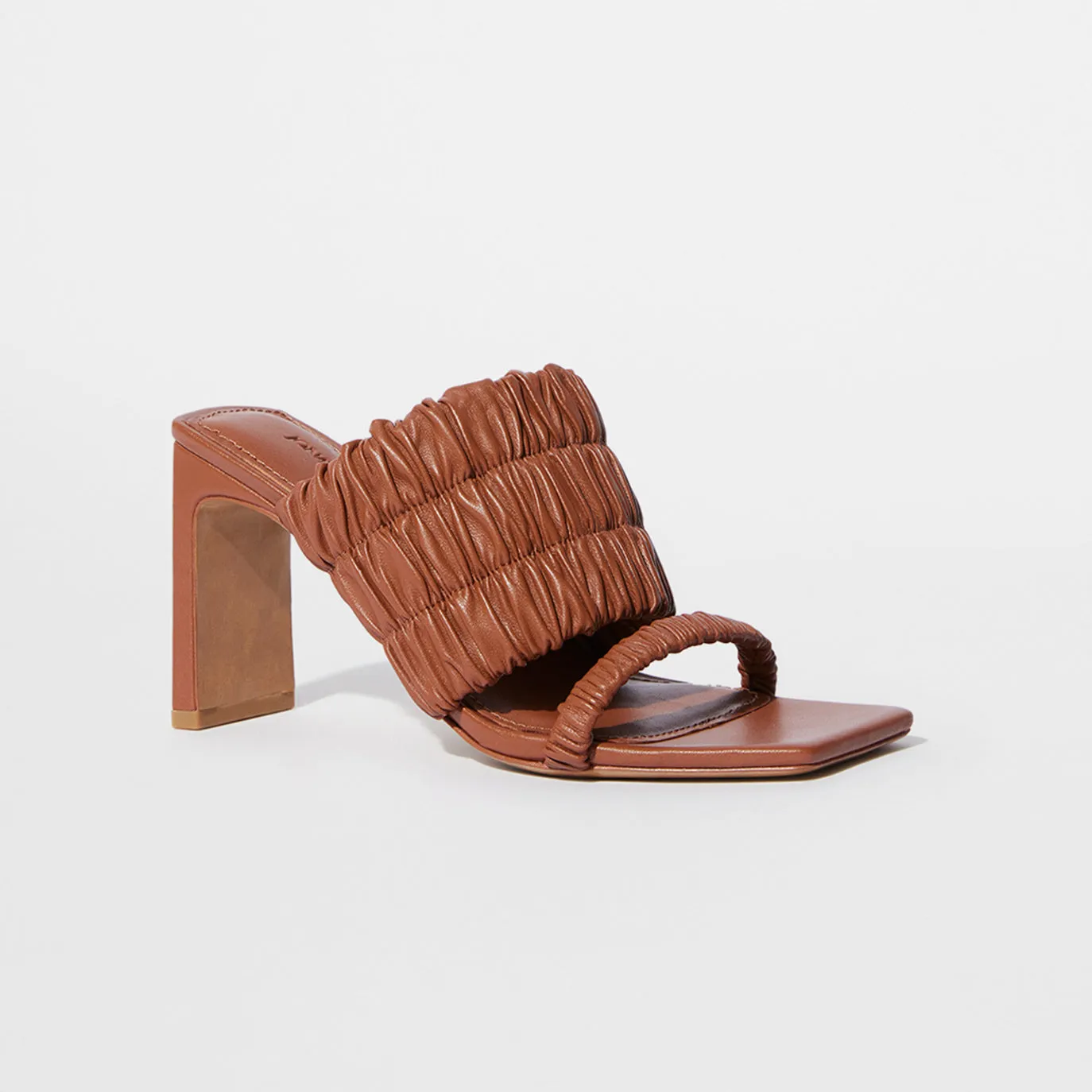 Felix Elastic Mules sold by Simkhai