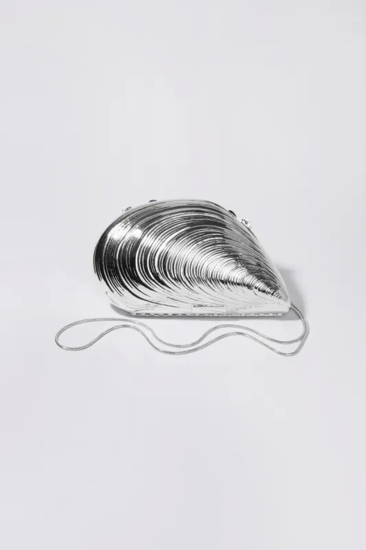 Bridget Metal Oyster Clutch sold by Simkhai