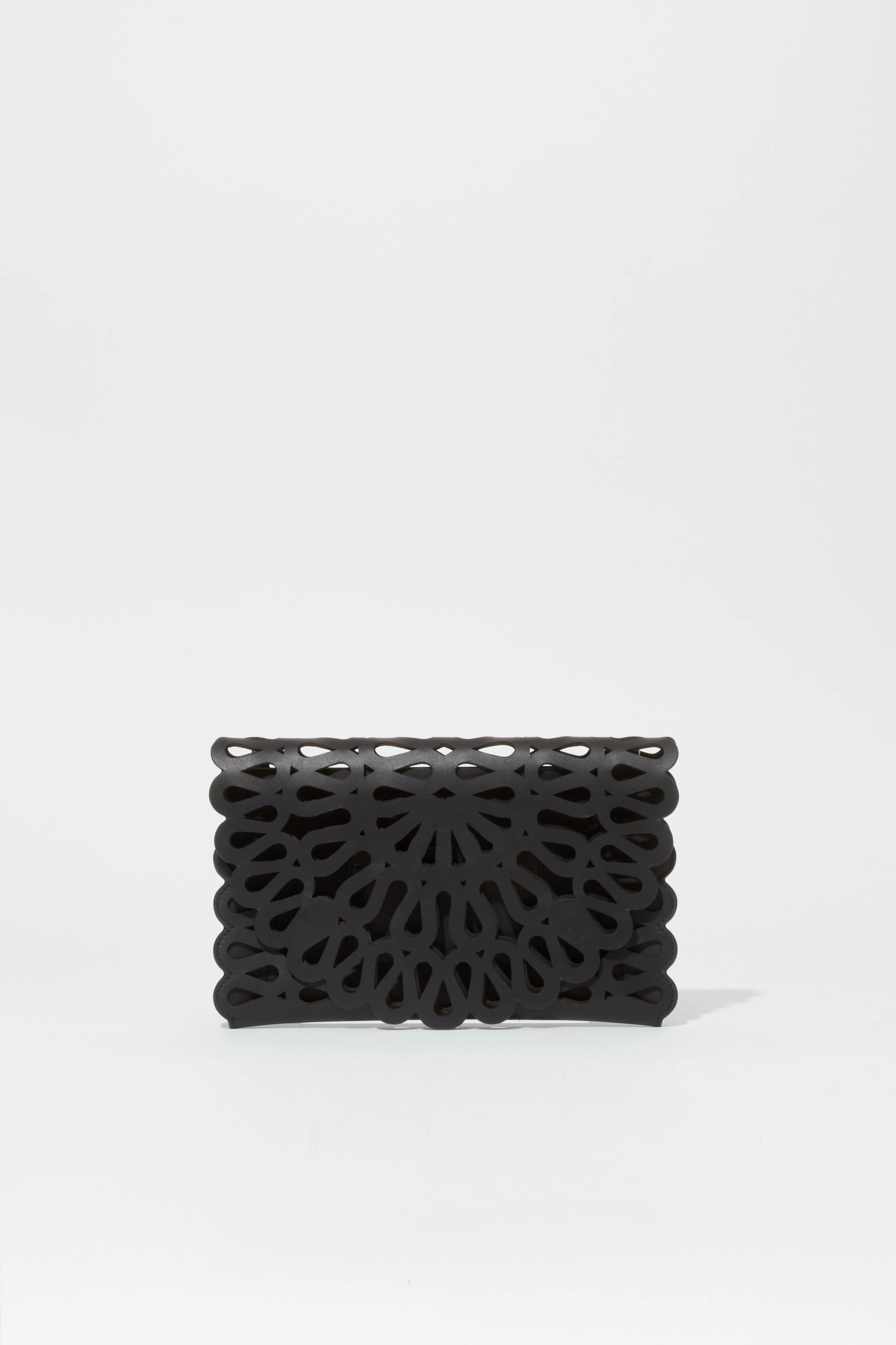 Mccall Laser Cut Leather Clutch sold by Simkhai