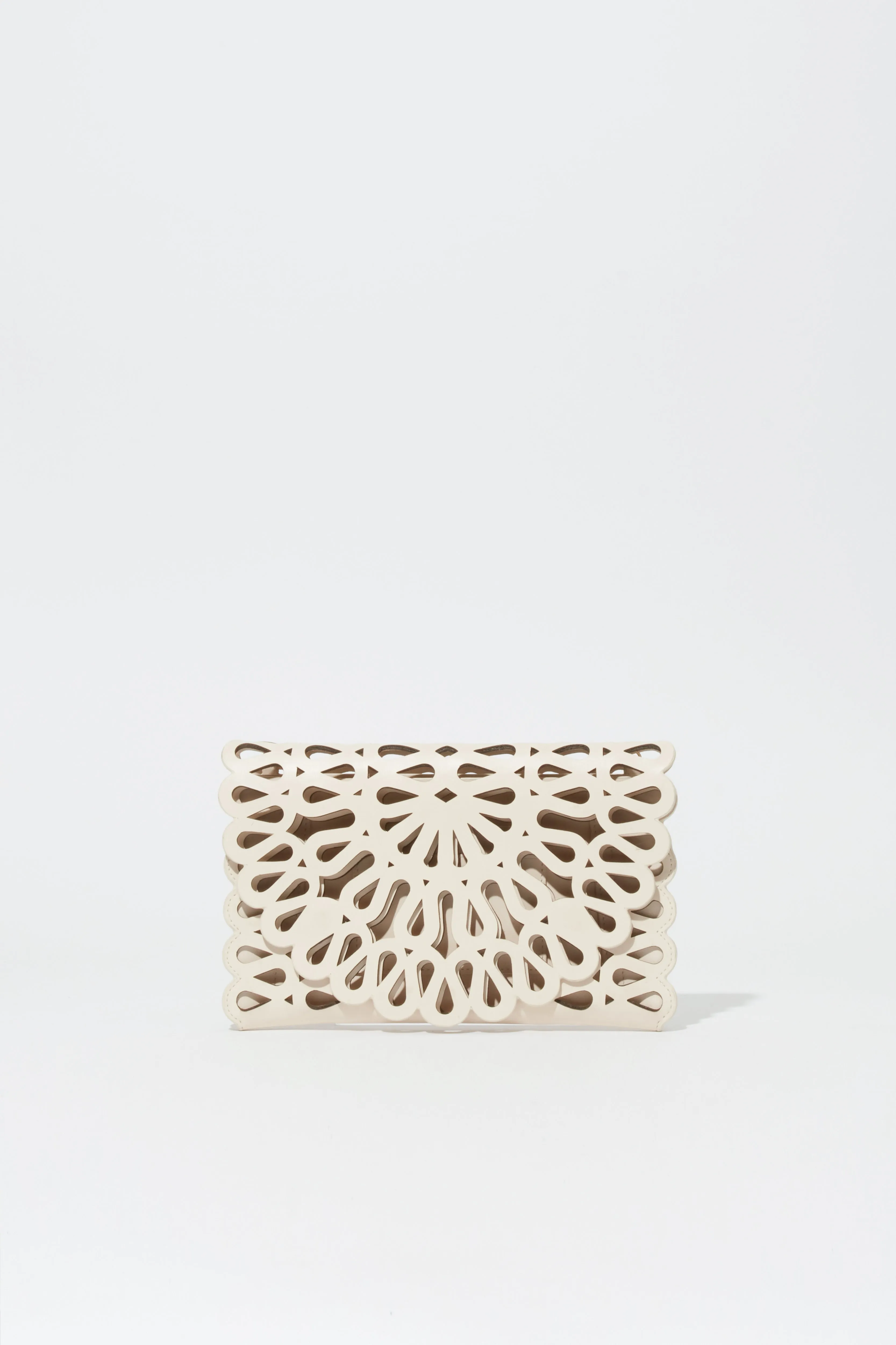 Mccall Laser Cut Leather Clutch sold by Simkhai