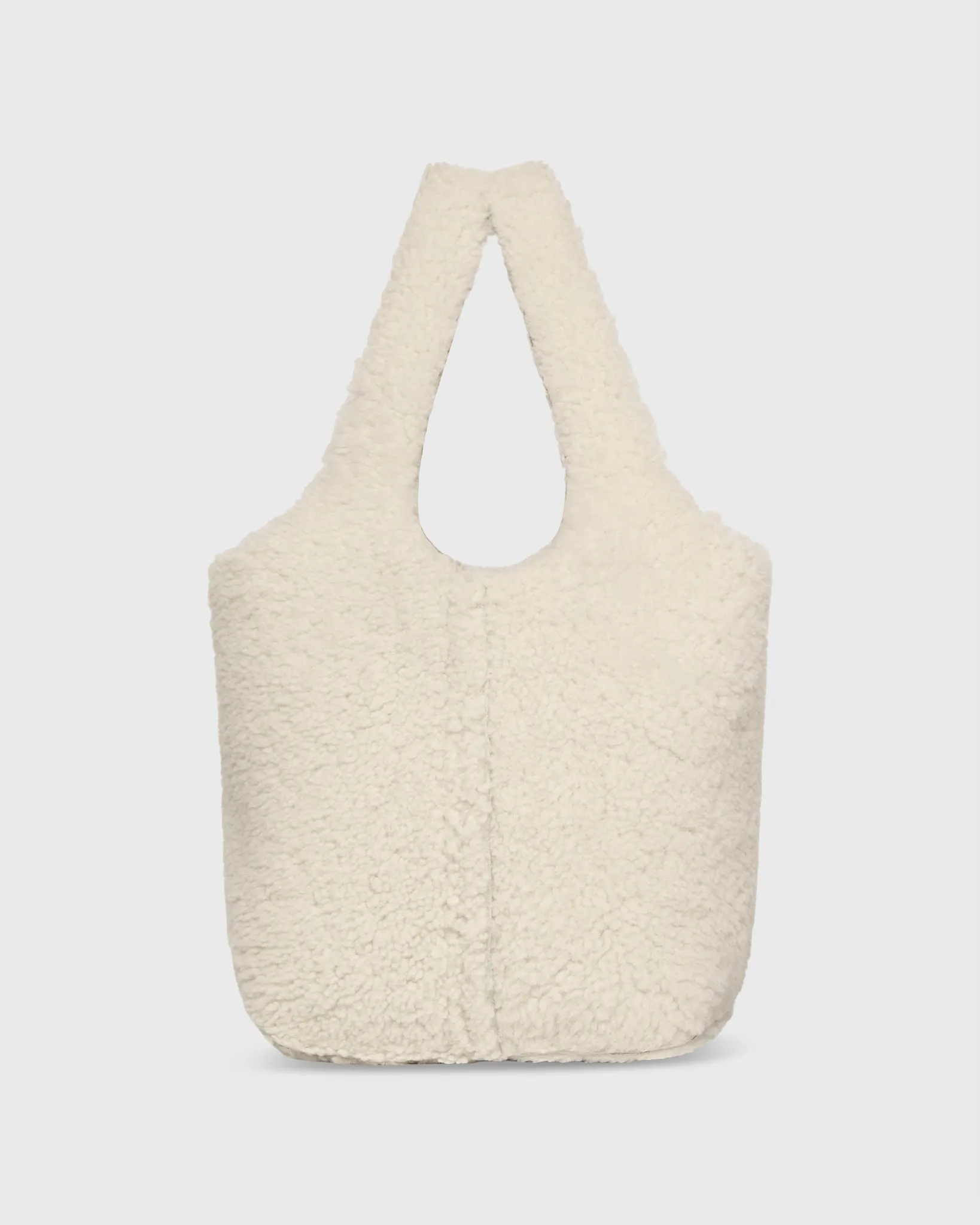 Paola Bucket Bag in Natural Shearling sold by Mashburn