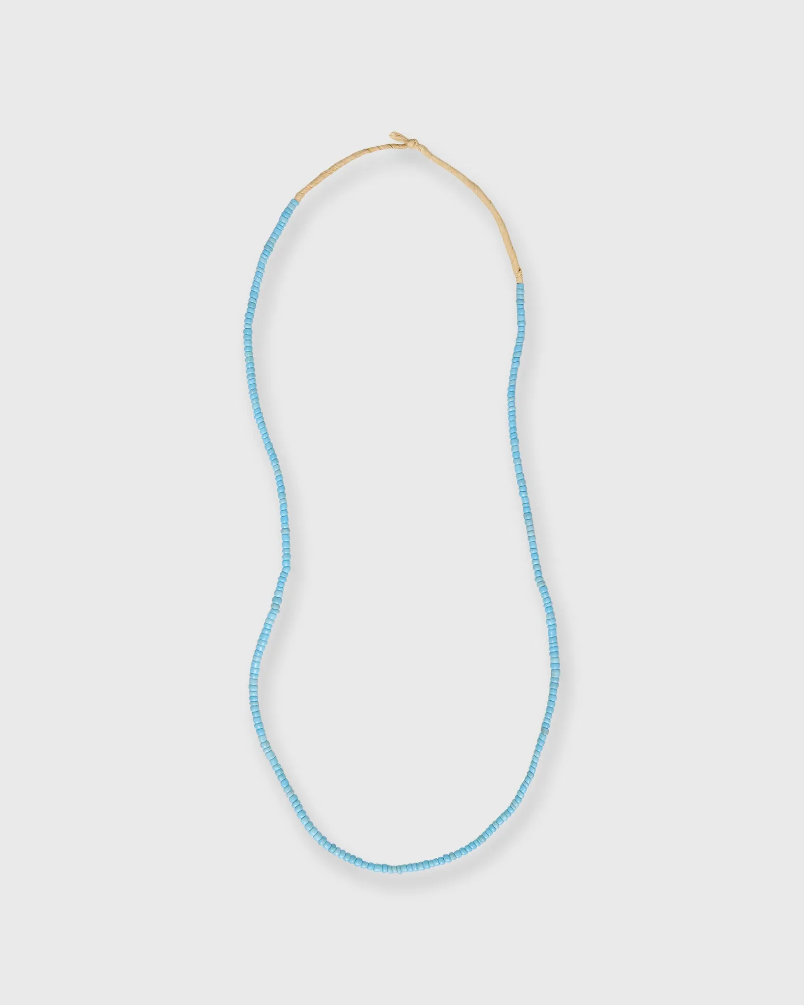 Tiny African Beads in Turquoise sold by Mashburn