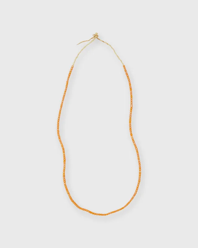 Very Small African Beads in Apricot sold by Mashburn