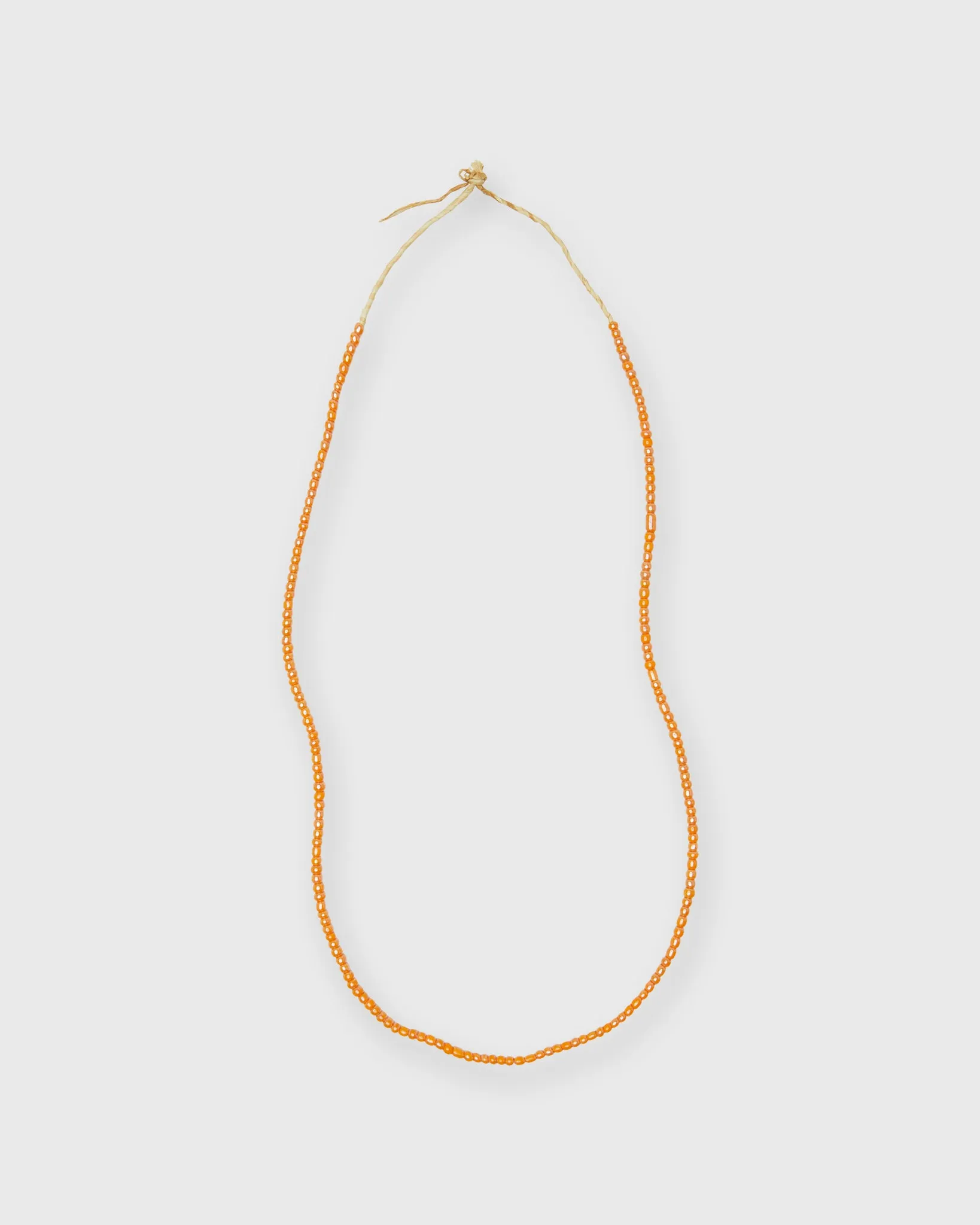 Very Small African Beads in Apricot sold by Mashburn