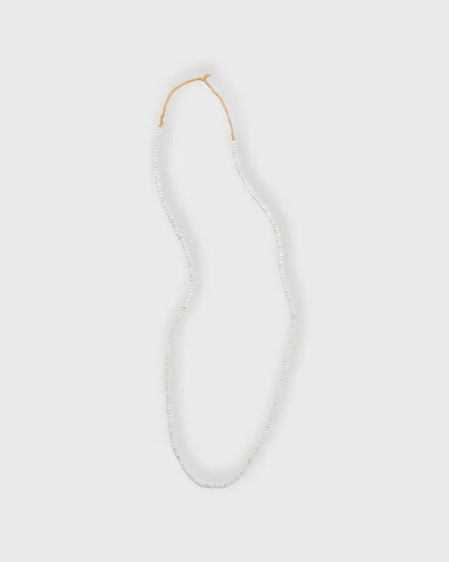 Tiny African Beads in Desert Sand sold by Mashburn