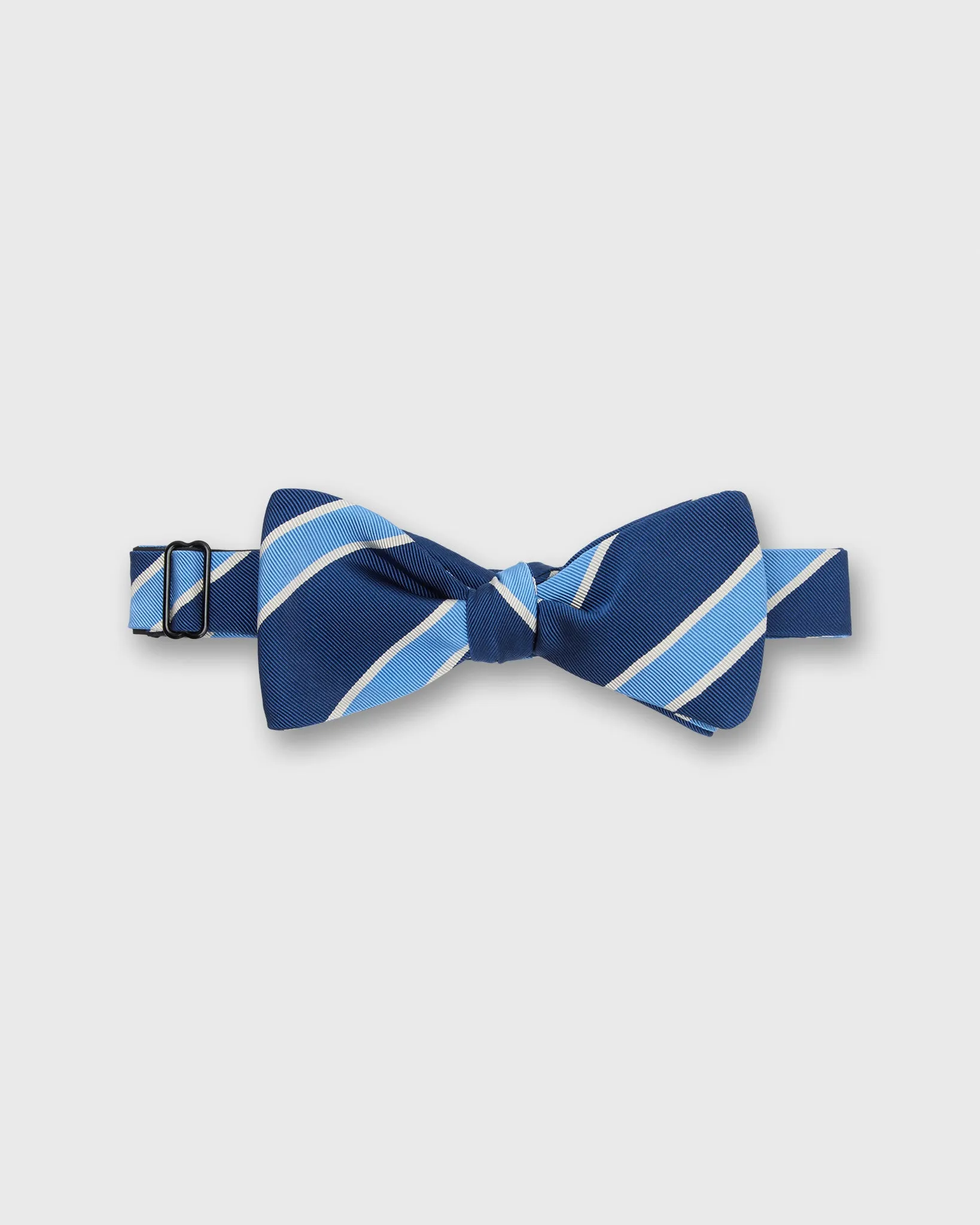 Silk Bow Tie in Navy/Cobalt Crescent Stripes sold by Mashburn