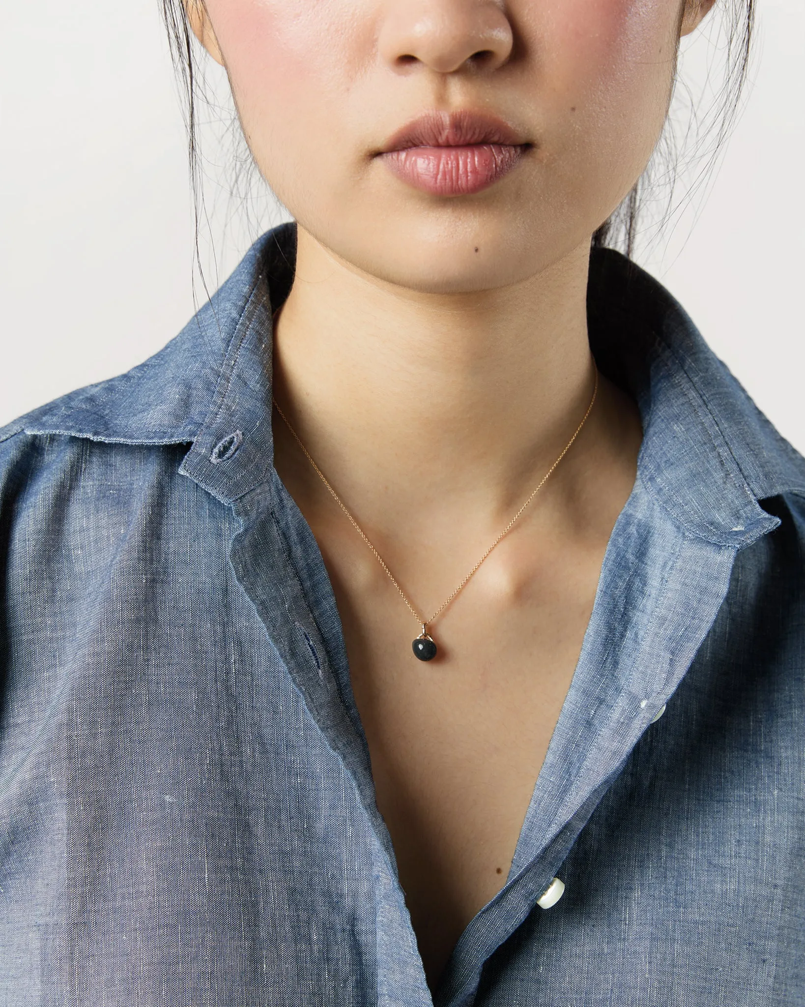 Tiny Ceramic Egg Pendant Necklace in Soot/Gold sold by Mashburn product image thumbnail 2