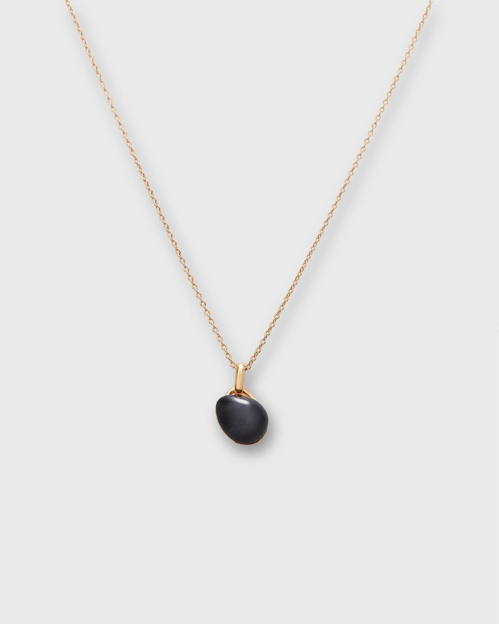 Tiny Ceramic Egg Pendant Necklace in Soot/Gold sold by Mashburn