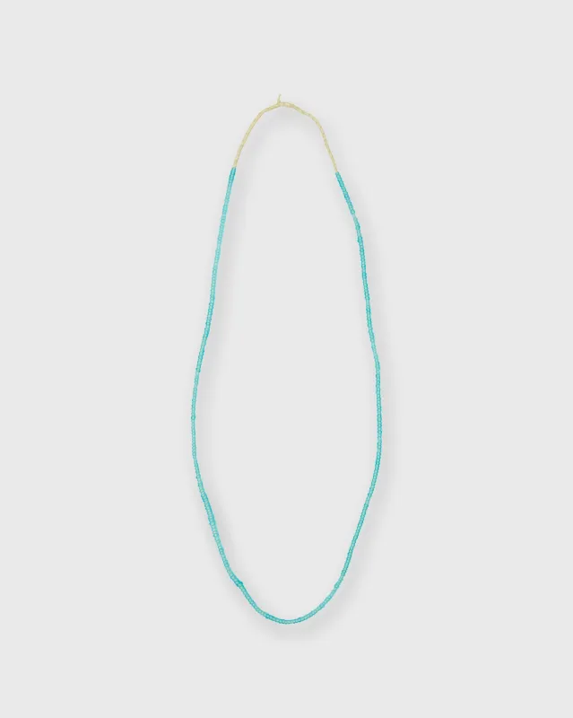 Tiny African Beads in Translucent Turquoise sold by Mashburn