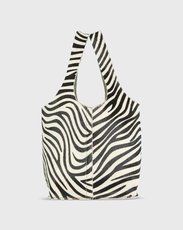 Paola Bucket Bag in Zebra Calf Hair sold by Mashburn
