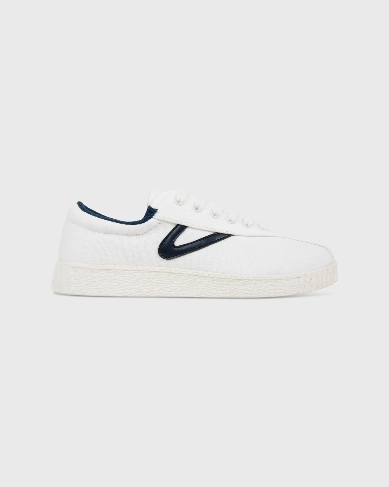 Women's Nylite Canvas Sneaker in White/Navy sold by Mashburn