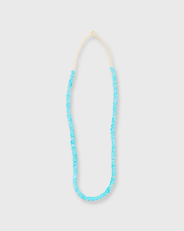 Small African Beads in Turquoise Whiteheart sold by Mashburn