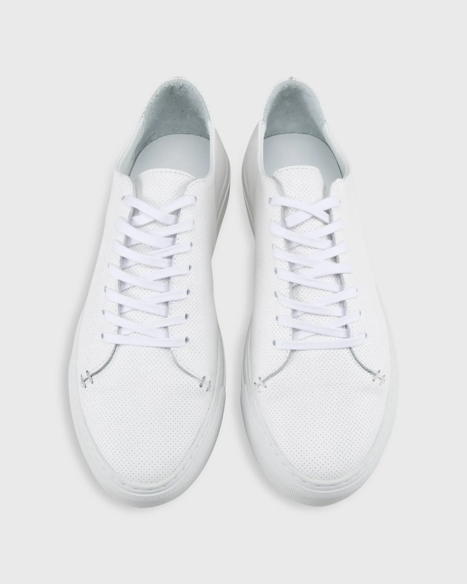 Low-Top Lace-Up Sneaker in White Perforated Leather sold by Mashburn