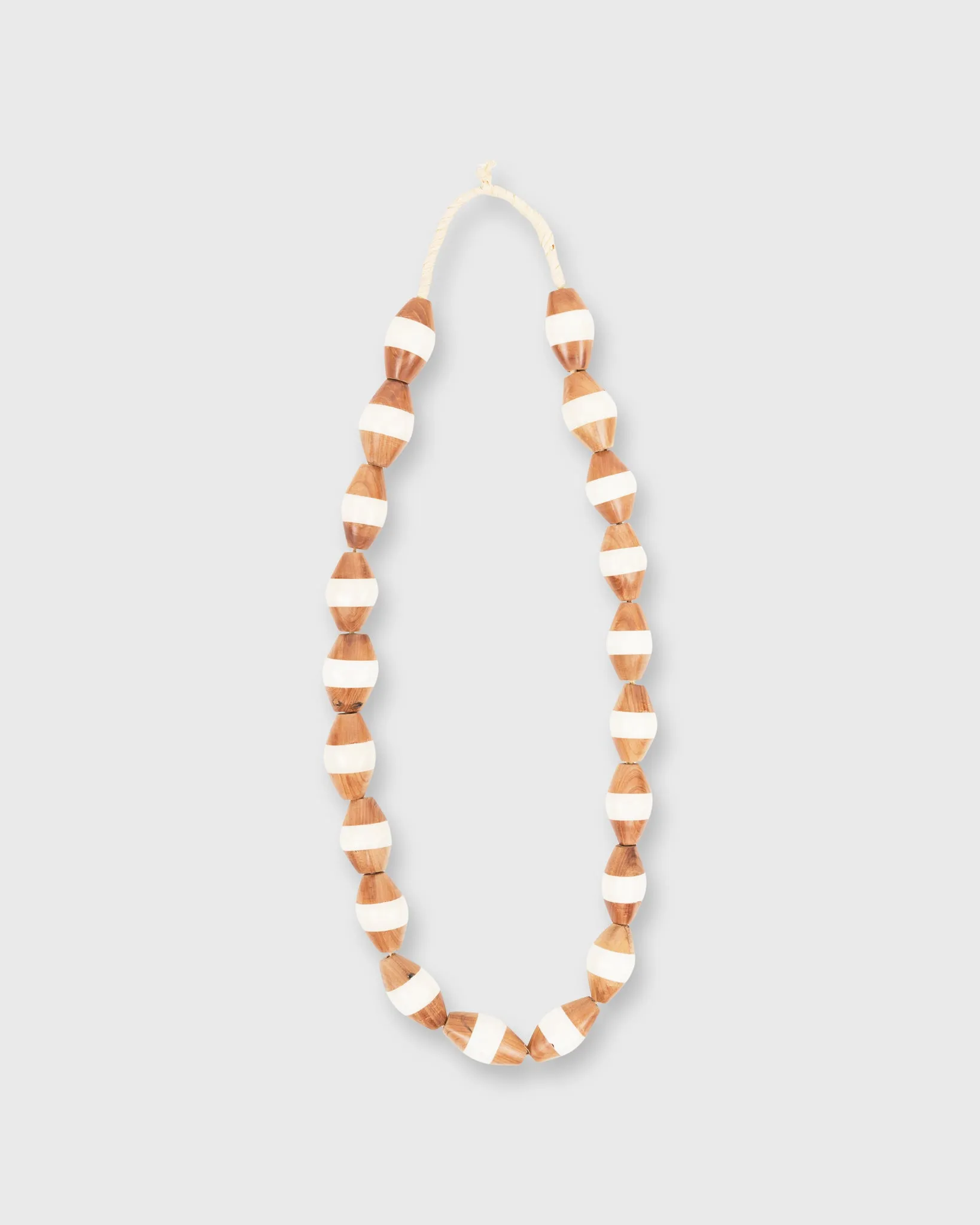 Large Two-Tone Cowbone Beads in Wood/Ivory sold by Mashburn