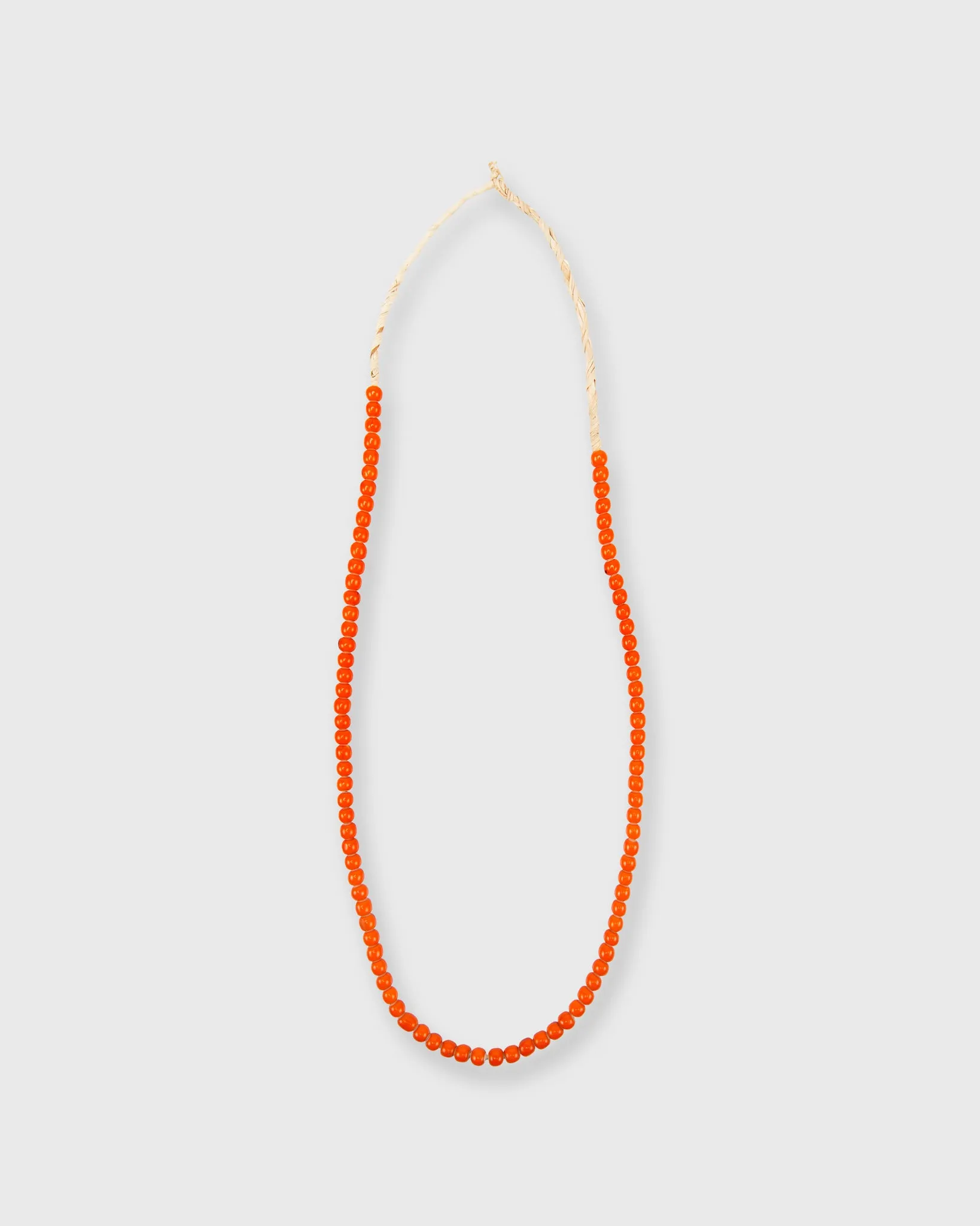 Small African Beads in Orange sold by Mashburn