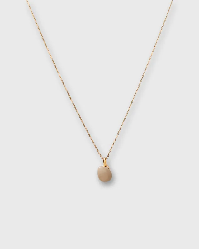 Tiny Ceramic Egg Pendant Necklace in Almond/Gold sold by Mashburn