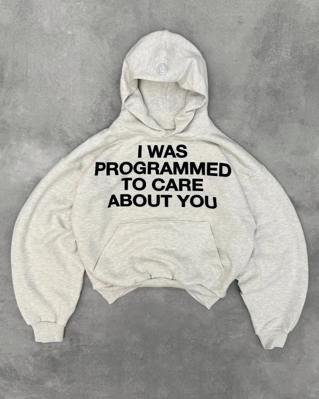 "PROGRAMMED TO CARE" HOODIE sold by Artificial Fever