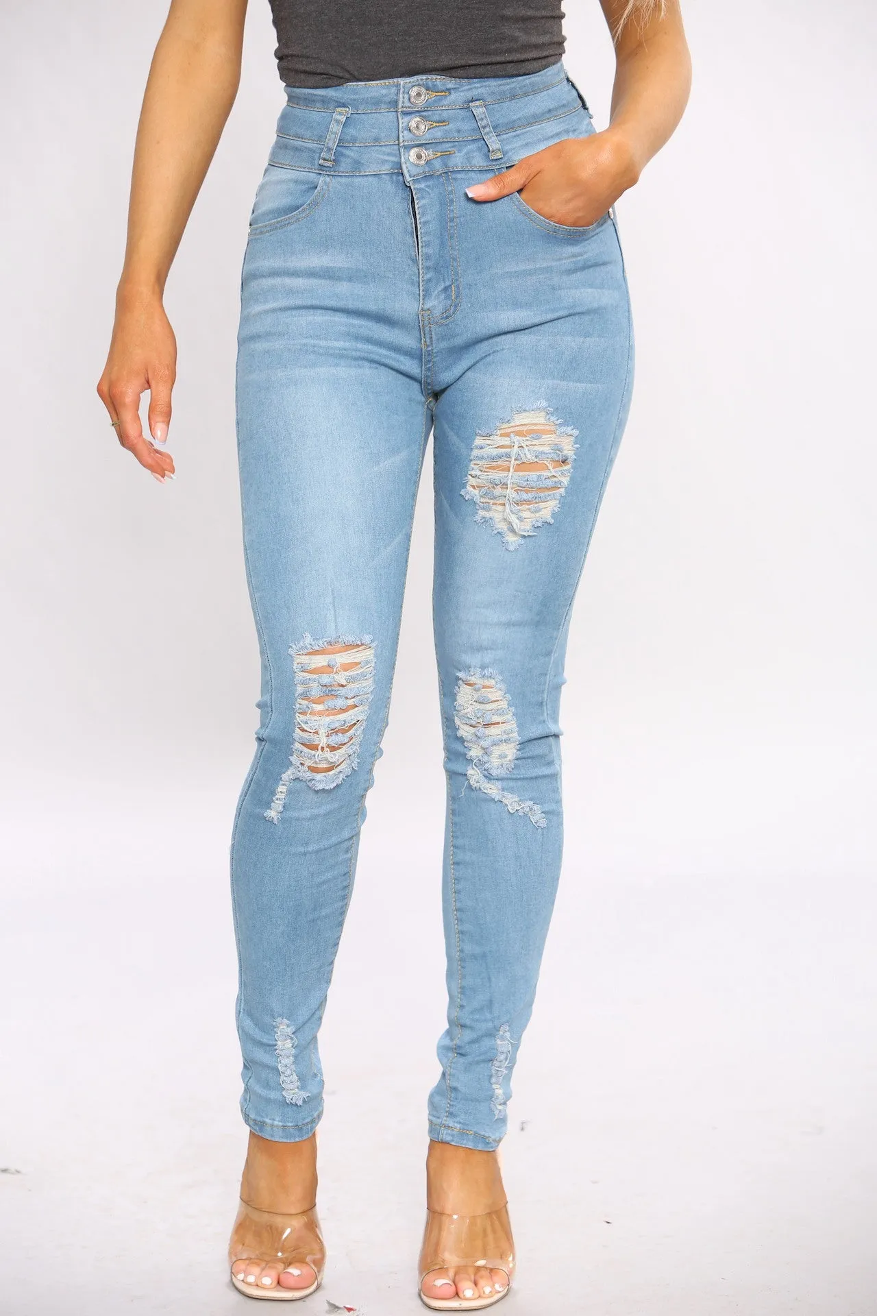 Blue Ripped Three Button Hem Skinny Jeans sold by Denimwise