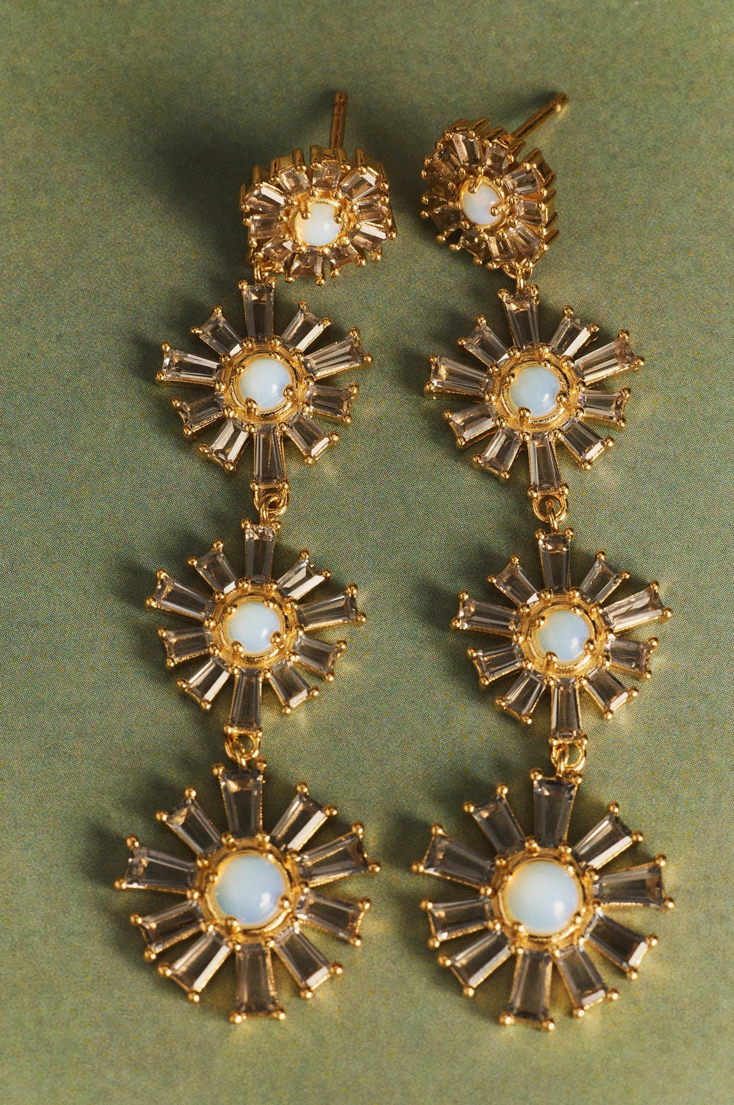 Long moon earrings sold by Apodemia