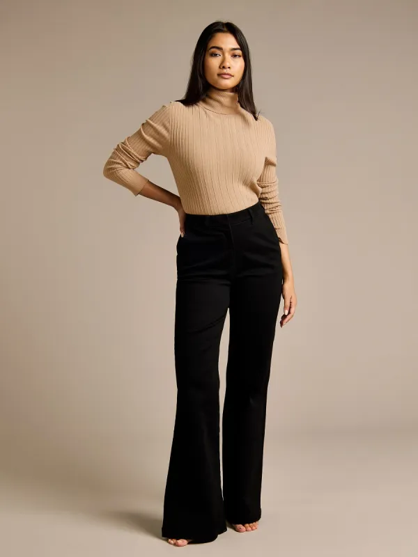 Lizzie Turtle Neck Fine Knit Jumper & Betty Black Flared Denim Jean Outfit sold by George W. Davies