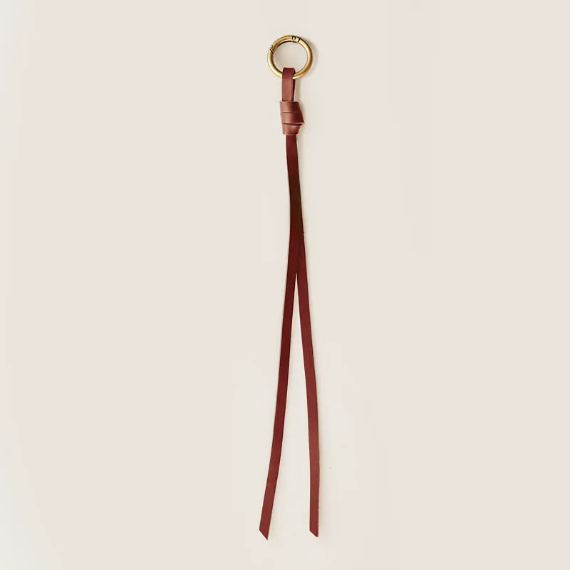 Long Leather Bag Charm - Cognac sold by Parker Thatch