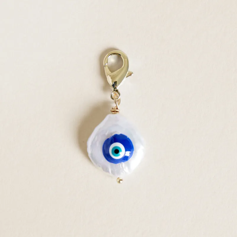 Mother of Pearl Evil Eye Charm sold by Parker Thatch