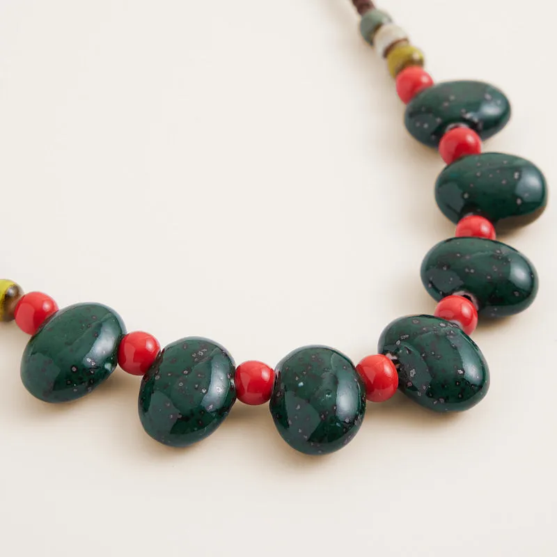 Green & Red Bead Bag Charm sold by Parker Thatch