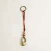 Stacked Pebble Bag Charm - Cognac sold by Parker Thatch