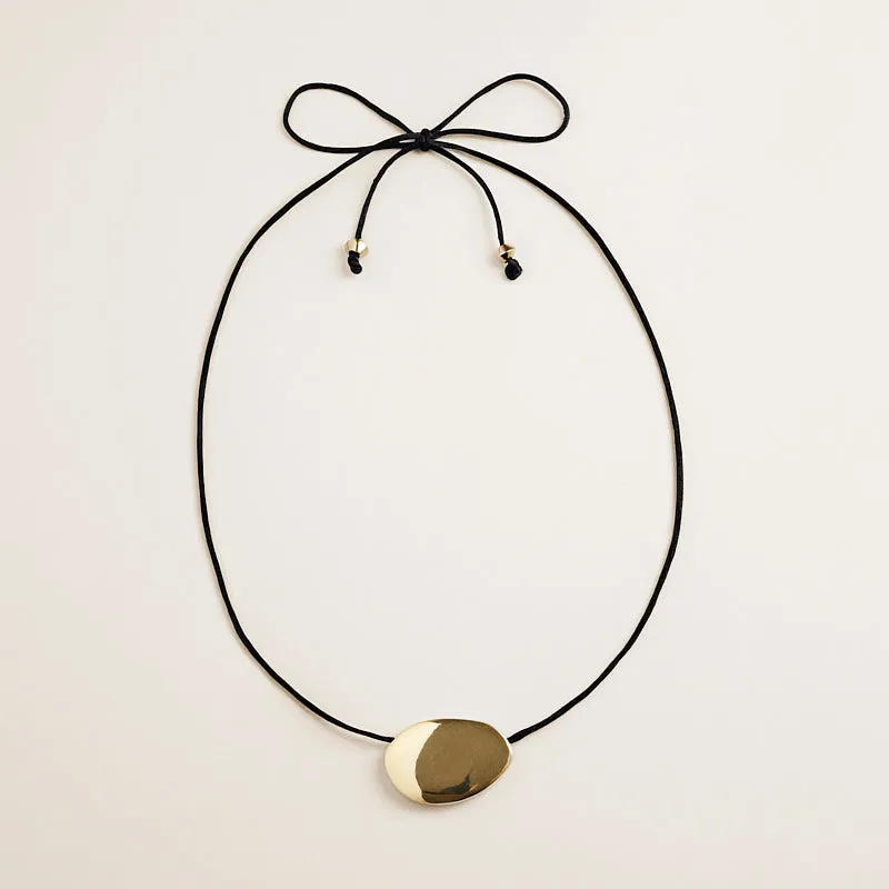 Pebble Pendant Necklace with Black Satin Cord sold by Parker Thatch