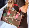 Parker - Camo Nylon with Red Leather Saddle Handle and Piping sold by Parker Thatch