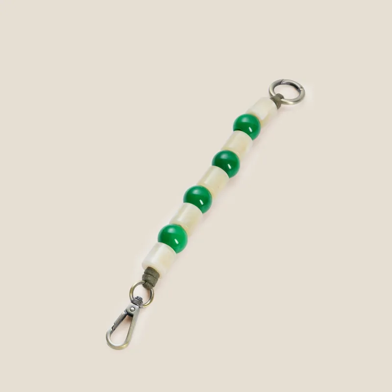 Green & White Beaded Bag Charm made by Parker Thatch