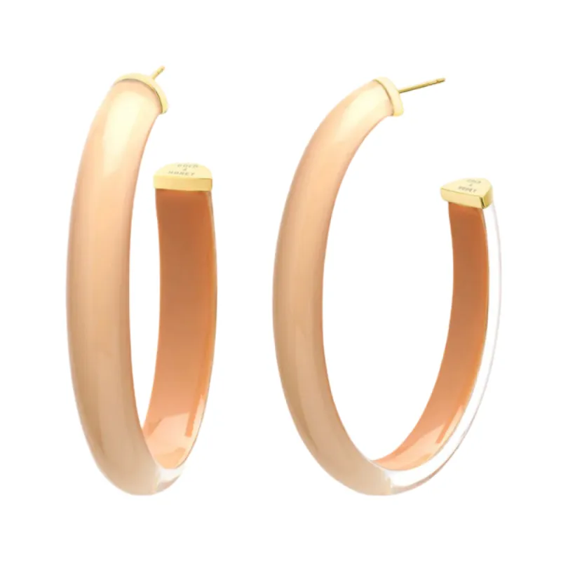Neutral Oval Lucite Hoops sold by The Jewelry Edit