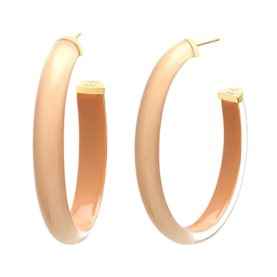 Neutral Oval Lucite Hoops sold by The Jewelry Edit