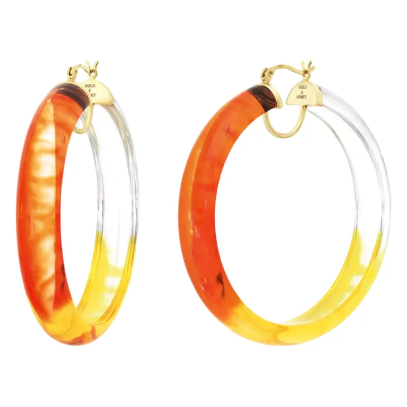 Tie-Dye Lucite Hoops in Red & Yellow sold by The Jewelry Edit
