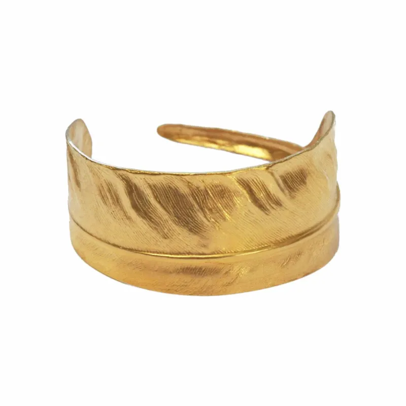 Gold Feather Cuff sold by The Jewelry Edit