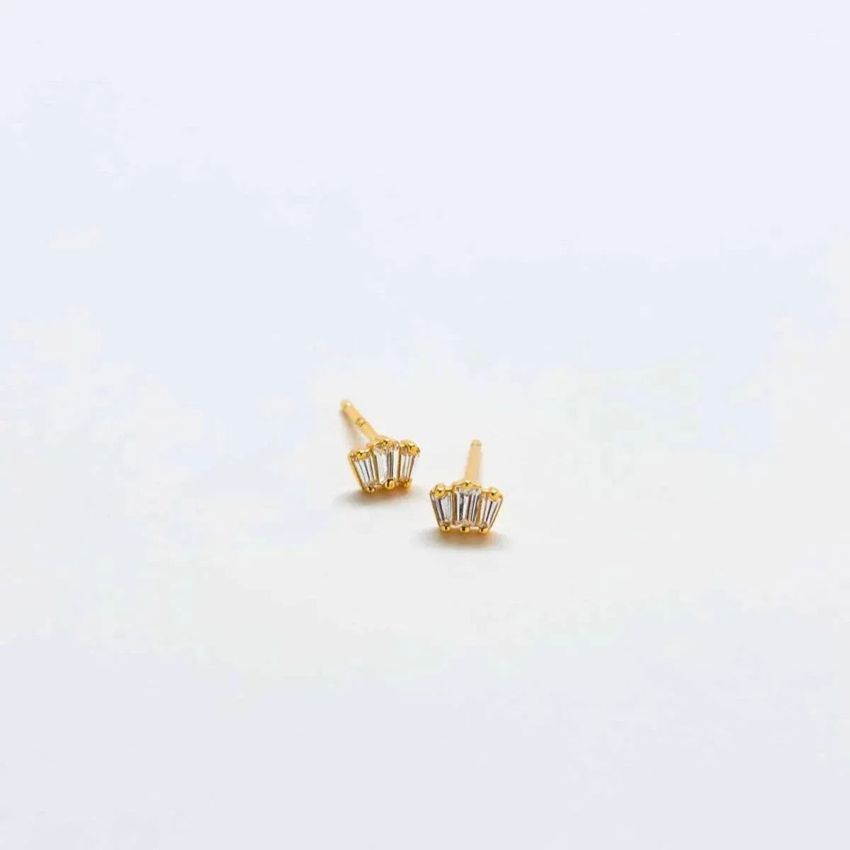 White Trio Baguette Gold Vermeil Studs sold by The Jewelry Edit