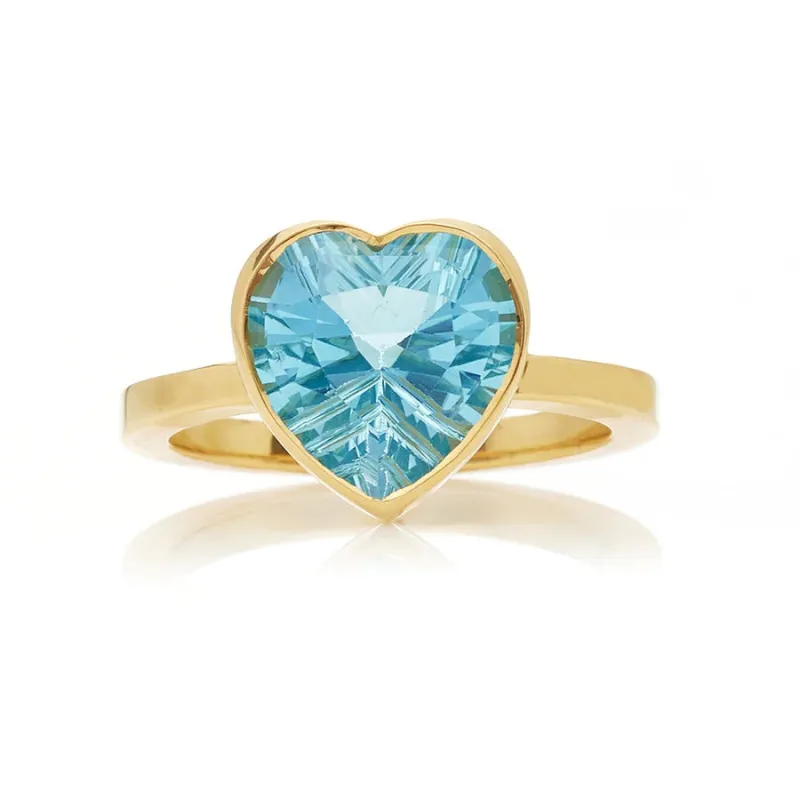 Blue topaz large heart bezel ring sold by The Jewelry Edit