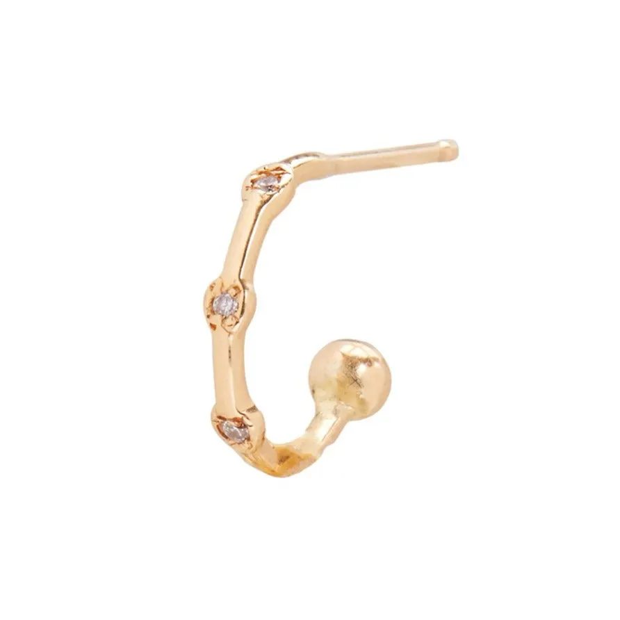 Diamond Trio Huggie sold by The Jewelry Edit