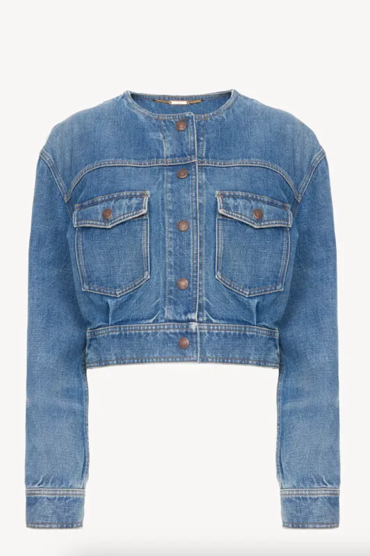 Collarless cropped jacket in denim sold by Curio