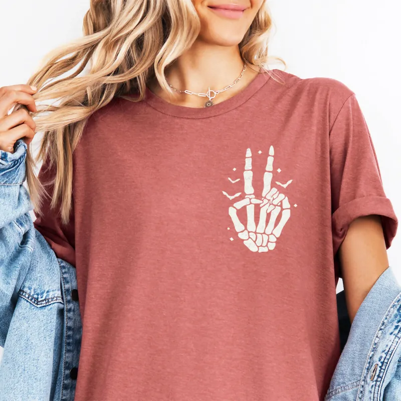 Skeleton Peace Sign Pocket Halloween Graphic Tee sold by Roxie’s Picks