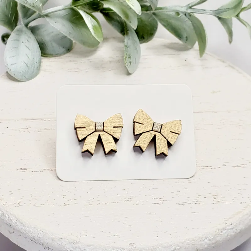 Gold Metallic Bow Studs sold by Roxie’s Picks