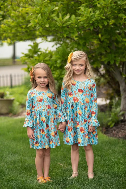Claire Mustard Teal Floral Dress sold by Roxie’s Picks