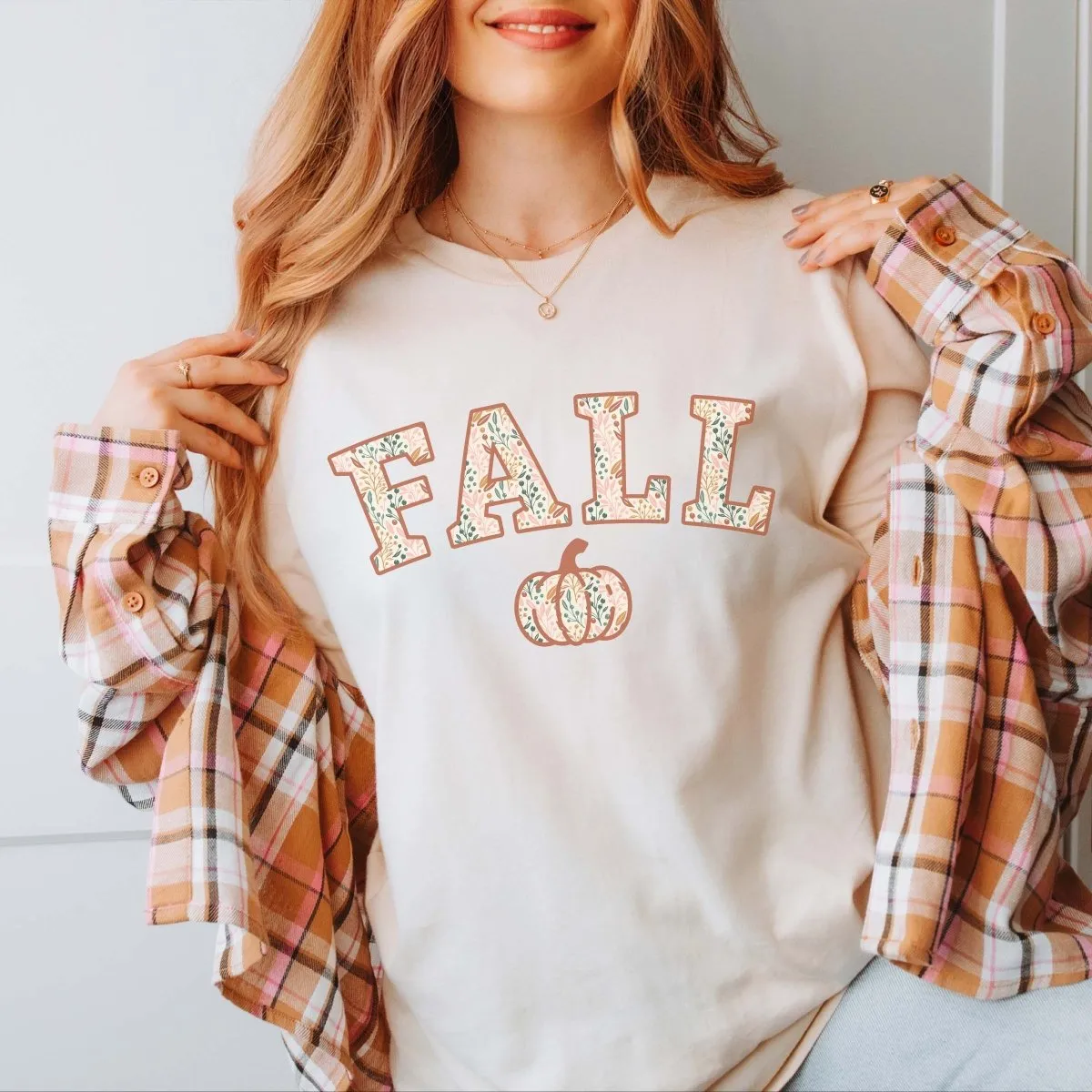 Fall Pumpkin Floral Pattern Bella Graphic Tee sold by Roxie’s Picks